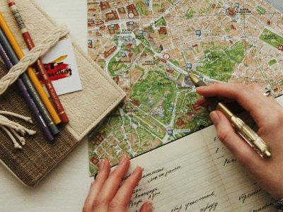 A pair of spectacles resting on a printed map