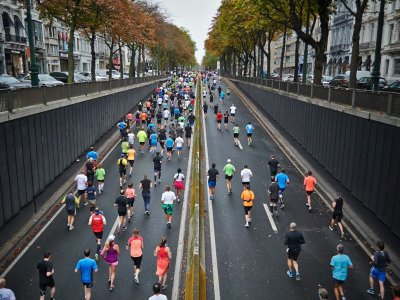 Runners filling a city road during a marathon