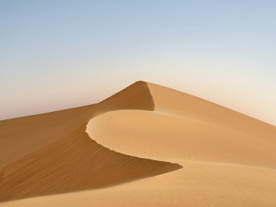 Rippled golden sand dunes in the Arabian desert outside Dubai