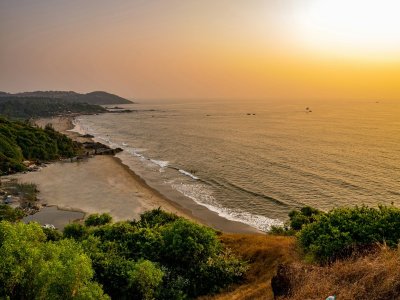 The sun setting over the Arabian Sea from a quiet beach